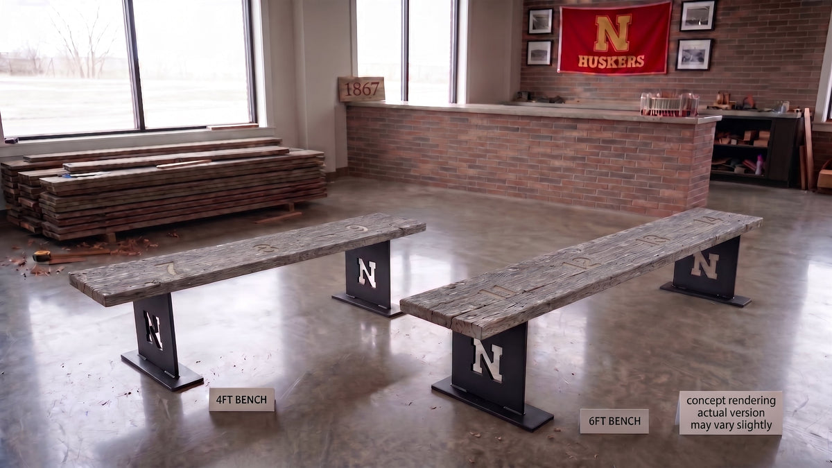 A Memorial Stadium bench plank on feet.